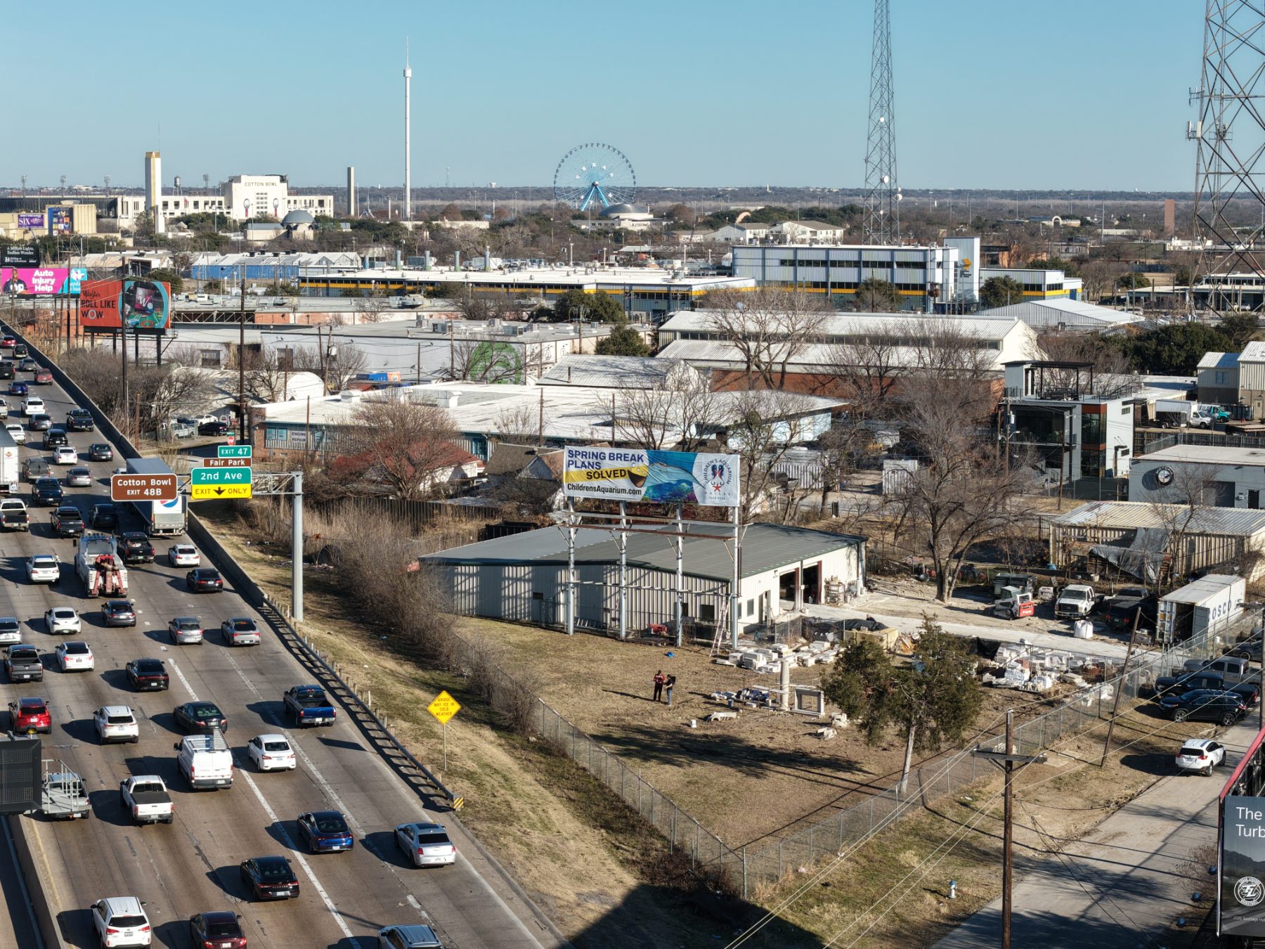 Children’s Aquarium Dallas billboard over I-30 traffic, drone photo 6