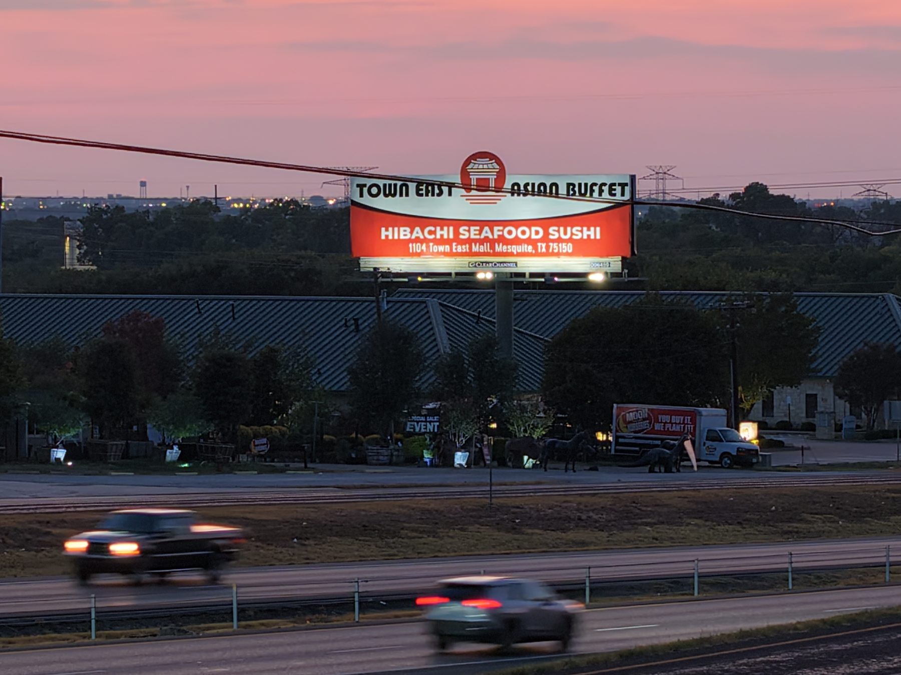 Town East Asian Buffet lit billboard with logo extension in Mesquite at dusk
